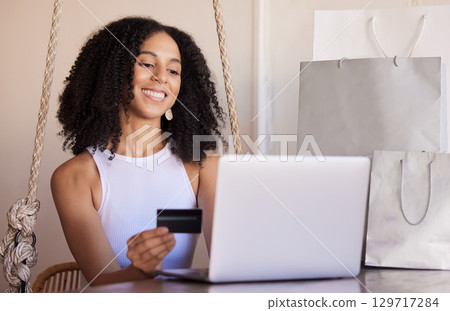 Credit card, laptop and online shopping, payment and bills in home, happy smile and sale promotion, discount and buy. Ecommerce, black woman and internet subscription upgrade, buying and banking 129717284