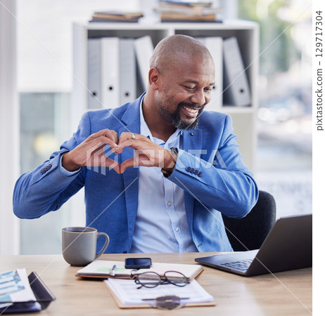 Business, hands in heart and black man in office with laptop, notebook and coffee at corporate workplace. Success, leadership and male entrepreneur with hand sign for thank you, support and community Business, hands in heart and black man in office with laptop, notebook and coffee at corporate workplace. Success, leadership and male entrepreneur with hand sign for thank you, support and community 129717304