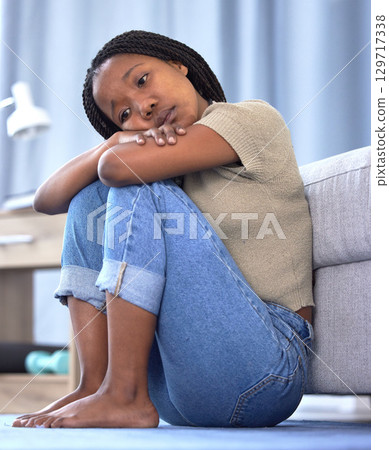 Black woman, sad or depression in house, home or mental health problem for sad news, grief or loss. Anxiety, burnout or psychology stress for girl in living room, depressed or frustrated with mistake 129717338