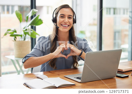 Woman, call center and laptop with heart gesture for telemarketing, customer service or support at the office. Portrait of happy employee consultant with smile and hands with love symbol by computer Woman, call center and laptop with heart gesture for telemarketing, customer service or support at the office. Portrait of happy employee consultant with smile and hands with love symbol by computer 129717371