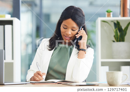 Black woman, business and phone call while writing in notebook, journal and planner at office desk. Female entrepreneur talking on smartphone while planning notes for agenda, schedule and information Black woman, business and phone call while writing in notebook, journal and planner at office desk. Female entrepreneur talking on smartphone while planning notes for agenda, schedule and information 129717401