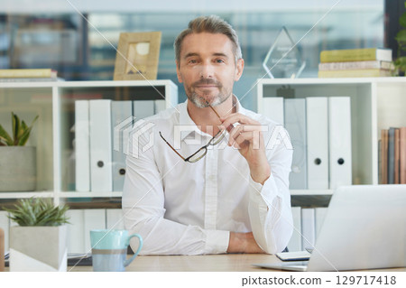 Portrait, businessman or ceo in leadership thinking of a creative advertising or marketing strategy in office building. Face, vision or thoughtful boss with glasses with growth mindset or solutions Portrait, businessman or ceo in leadership thinking of a creative advertising or marketing strategy in office building. Face, vision or thoughtful boss with glasses with growth mindset or solutions 129717418