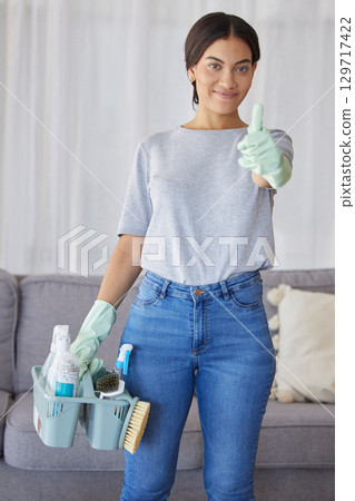 Cleaner, thumbs up and portrait of a woman with supplies to clean the living room of a house. Happy, smile and female maid or housewife with a positive mindset for cleaning an apartment, loft or home Cleaner, thumbs up and portrait of a woman with supplies to clean the living room of a house. Happy, smile and female maid or housewife with a positive mindset for cleaning an apartment, loft or home 129717422