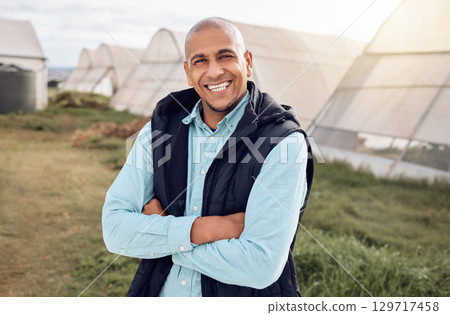 Black man, farmer and outdoor portrait with arms crossed, smile and happiness for sustainable farm. Farming expert, sustainability and happy in field by greenhouse with goals, vision and motivation 129717458