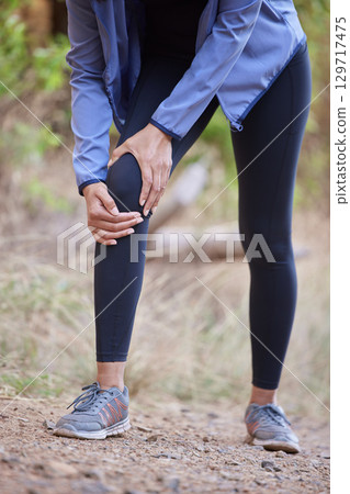 Fitness, knee pain and hands massage of woman in forest hiking, workout or running accident and body zoom for health insurance. Legs injury, joint pain or arthritis of athlete, runner in medical risk Fitness, knee pain and hands massage of woman in forest hiking, workout or running accident and body zoom for health insurance. Legs injury, joint pain or arthritis of athlete, runner in medical risk 129717475