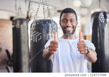 Black man, thumbs up and fitness, wellness and exercise health lifestyle with positive mindset in gym. Motivation, success and portrait for happy training workout, sports athlete and healthy goal 129717490