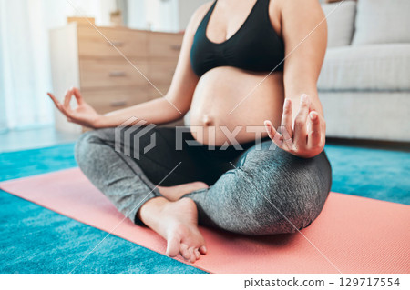 Yoga, pregnant and woman with meditation, lotus pose and peace, zen and calm with mindfulness, exercise for prenatal health. Self care, wellness and pregnancy fitness, pregnant woman and balance. Yoga, pregnant and woman with meditation, lotus pose and peace, zen and calm with mindfulness, exercise for prenatal health. Self care, wellness and pregnancy fitness, pregnant woman and balance. 129717554