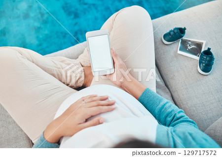 Pregnant, woman and blank phone for social media sonogram post or announcement at home. Pregnancy, mother and internet communication about baby picture or ultrasound with shoes for media message Pregnant, woman and blank phone for social media sonogram post or announcement at home. Pregnancy, mother and internet communication about baby picture or ultrasound with shoes for media message 129717572