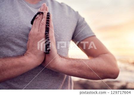 Prayer, yoga or hands in gratitude in nature or beach for relaxing, peaceful or calm freedom in Bali. God, meditation or zen man praying for mindfulness, soul or holistic spiritual chakra energy Prayer, yoga or hands in gratitude in nature or beach for relaxing, peaceful or calm freedom in Bali. God, meditation or zen man praying for mindfulness, soul or holistic spiritual chakra energy 129717604