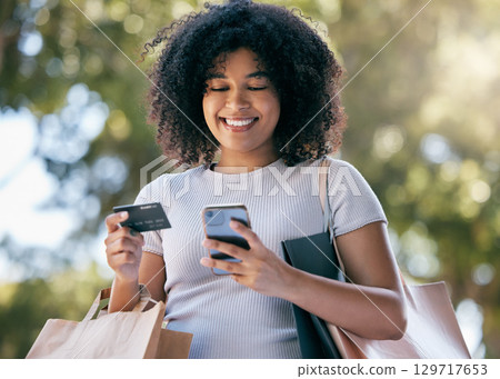 Woman, shopping and phone with credit card for ecommerce purchase or payment outside. Online, mobile and fintech for retail sale or discount pay with a female shopper buying with e commerce 129717653