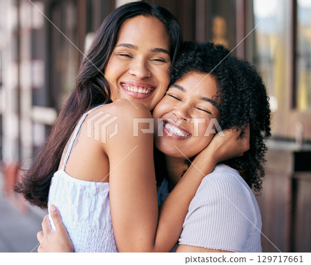 Friends, love and care with hug while bonding outside in the city during a summer trip. Bond, loving and caring friendship with cheerful women embrace with affection in a positive, happy relationship Friends, love and care with hug while bonding outside in the city during a summer trip. Bond, loving and caring friendship with cheerful women embrace with affection in a positive, happy relationship 129717661