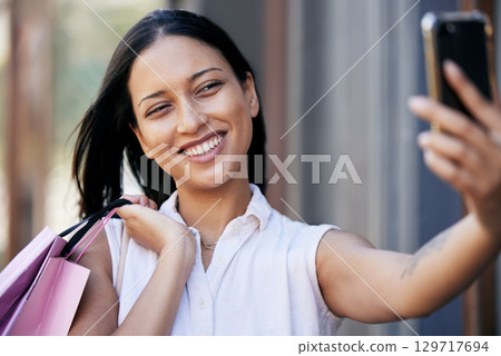 Woman, city shopping and phone selfie, social media post and fashion influencer with mobile app, technology and connection. Happy shopper girl, smartphone and taking photograph, video call and memory Woman, city shopping and phone selfie, social media post and fashion influencer with mobile app, technology and connection. Happy shopper girl, smartphone and taking photograph, video call and memory 129717694