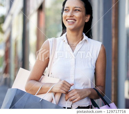 Walking, happy woman shopping and city customer smile for discount sales, luxury fashion products and town market trip. Wealthy, rich and young consumer on vacation travel in Milan, Italy with bag Walking, happy woman shopping and city customer smile for discount sales, luxury fashion products and town market trip. Wealthy, rich and young consumer on vacation travel in Milan, Italy with bag 129717716