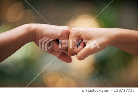 Fist bump, friends and hands together for welcome with support, diversity and partnership collaboration. Bokeh background, racism and friendship goal welcome greeting collaboration outdoor with bokeh Fist bump, friends and hands together for welcome with support, diversity and partnership collaboration. Bokeh background, racism and friendship goal welcome greeting collaboration outdoor with bokeh 129717735