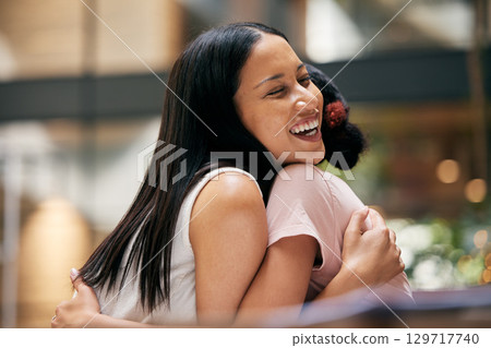 Friends, hug and happy at a mall for quality time, date or shopping together for fun, freedom and bonding. Females hugging for love, support and trust in friendship while excited for holiday visit Friends, hug and happy at a mall for quality time, date or shopping together for fun, freedom and bonding. Females hugging for love, support and trust in friendship while excited for holiday visit 129717740