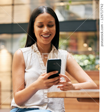 Relax, phone and smile with woman in cafe for communication, search and social media. Networking, contact and digital with girl and mobile in coffee shop for technology, internet and online news Relax, phone and smile with woman in cafe for communication, search and social media. Networking, contact and digital with girl and mobile in coffee shop for technology, internet and online news 129717742