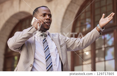 Angry African businessman, phone call and street for question, confused or conversation in metro. Lawyer black man, using phone or discussion on road for stress, anxiety or walk by urban buildings 129717805