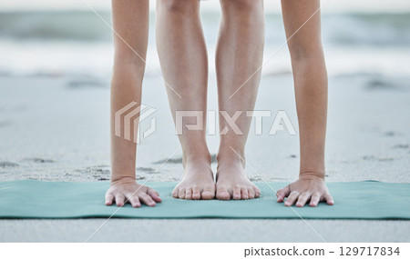 Feet, yoga and beach stretching for health and wellness, fitness and strength in nature. Seaside, sand and yoga mat for flexible yogi stretching or pilates training by the coast for healthy sport Feet, yoga and beach stretching for health and wellness, fitness and strength in nature. Seaside, sand and yoga mat for flexible yogi stretching or pilates training by the coast for healthy sport 129717834