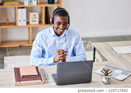 Customer service, call center and video call with black man on laptop in telemarketing office. Video conference, employee and male consultant from Nigeria on computer consulting online in webinar. 129717892