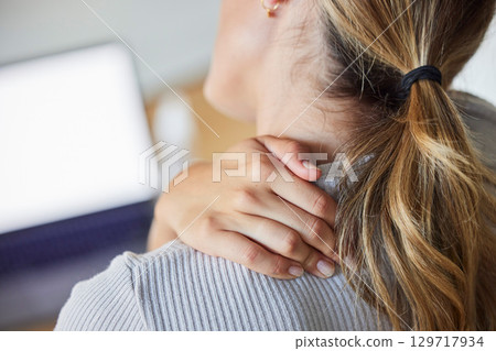 Business woman, stress and laptop with neck pain, tired and injury from working or strain in office. Burnout, overworked and stressed female worker massage sore, ache and muscle in neck in workplace Business woman, stress and laptop with neck pain, tired and injury from working or strain in office. Burnout, overworked and stressed female worker massage sore, ache and muscle in neck in workplace 129717934