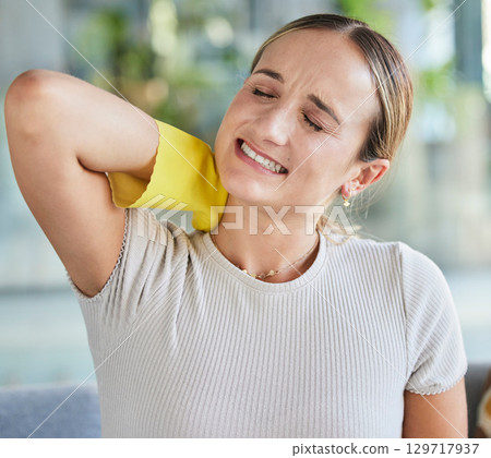 Cleaning, housekeeping and woman with neck pain tired with rubber gloves for housework and domestic chores. Burnout, suffering and housewife with body pain, ache and tension from spring cleaning home 129717937