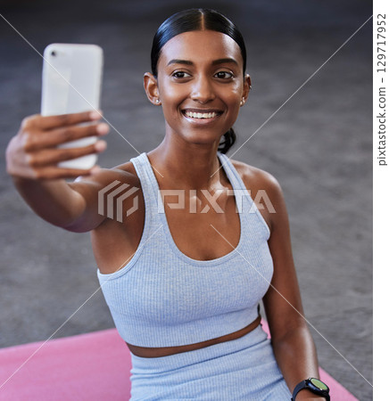 Fitness selfie, sports floor and woman with social media post, profile picture update or wellness website blog on mobile app. Smartphone photography, Indian athlete and pilates or cardio gym training Fitness selfie, sports floor and woman with social media post, profile picture update or wellness website blog on mobile app. Smartphone photography, Indian athlete and pilates or cardio gym training 129717952
