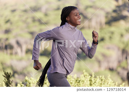 Fitness, nature and profile of black woman running in countryside, woods or forest for body goals, cardio health or wellness. Exercise, workout and happy African runner training for marathon race 129718014