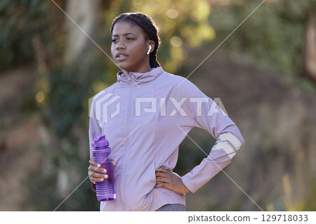 Exercise, water bottle and black woman outdoor, fitness and workout for wellness, power or health. Nigerian girl, young female or athlete with liquid, hydration or training in nature, rest or earbuds Exercise, water bottle and black woman outdoor, fitness and workout for wellness, power or health. Nigerian girl, young female or athlete with liquid, hydration or training in nature, rest or earbuds 129718033
