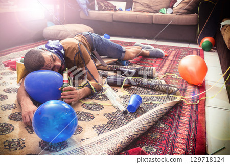Out like a light. Man sleeping, drunk with alcohol addiction and party, new year celebration with holiday and social event, hungover from drinks. Celebrate with beer, abuse and problem with drinking. Out like a light. Man sleeping, drunk with alcohol addiction and party, new year celebration with holiday and social event, hungover from drinks. Celebrate with beer, abuse and problem with drinking. 129718124