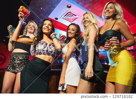 Dance, party and friends at a night club with drinks, disco celebration and happy during girls night. Dancing event, alcohol and women with cocktails during happy hour at a nightclub on new years 129718182