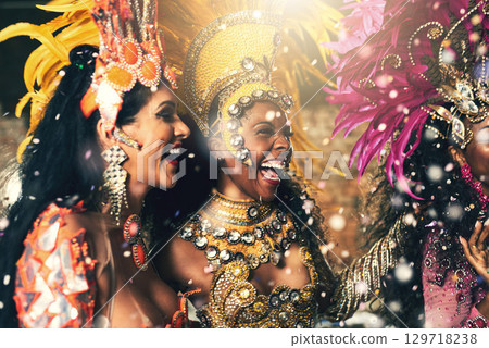 Women, samba and dancers hugging and bonding in costume before a carnival celebration. Party, festival and group of ladies in creative outfits in Rio de Janeiro for artist or artistic performance 129718238