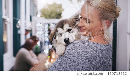 Woman holding her dog with love, care and happiness at a dinner, party or celebration at a house. Happy, smile and lady hugging her husky pet at a festive, new year or christmas event at home. Woman holding her dog with love, care and happiness at a dinner, party or celebration at a house. Happy, smile and lady hugging her husky pet at a festive, new year or christmas event at home. 129718312