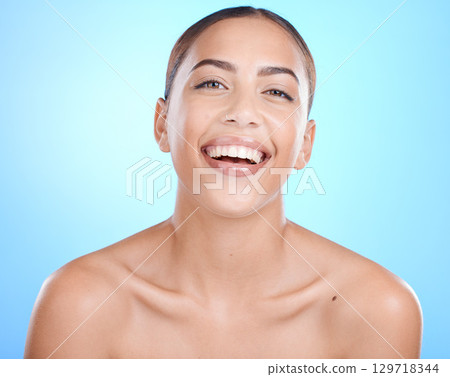 Skincare, beauty and portrait woman laughing with happy smile on blue background. Makeup, cosmetic glamour and luxury skin care with beautiful smiling face, natural cosmetics for lady from Brazil. 129718344