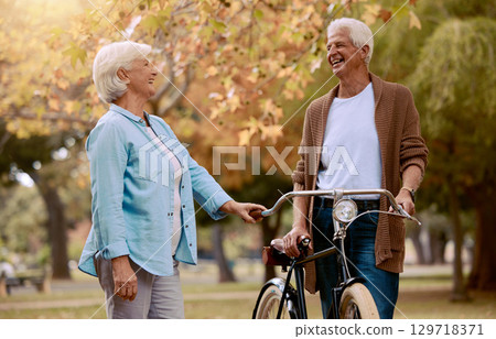 Bike, senior couple and ride outdoor for health, wellness, loving and bicycle. Retirement, love and mature man with elderly woman, cycling and bonding together for hobby, happy or riding for wellness Bike, senior couple and ride outdoor for health, wellness, loving and bicycle. Retirement, love and mature man with elderly woman, cycling and bonding together for hobby, happy or riding for wellness 129718371