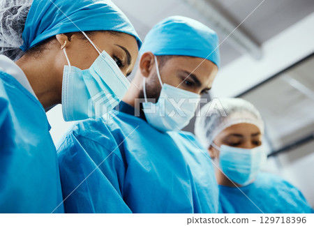 Mask, staff and surgery for medical in hospital, healthcare and emergency room for diagnosis. Doctor, nurse and team support, recovery and heart failure procedure for patient, face cover and hygiene. 129718396