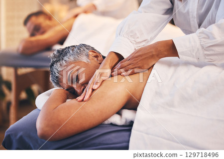 Massage, spa and woman enjoying a body treatment with her husband to relax, rest and be calm. Beauty, bodycare and luxury routine with a massage therapist in a beauty spa treating a mature female Massage, spa and woman enjoying a body treatment with her husband to relax, rest and be calm. Beauty, bodycare and luxury routine with a massage therapist in a beauty spa treating a mature female 129718496