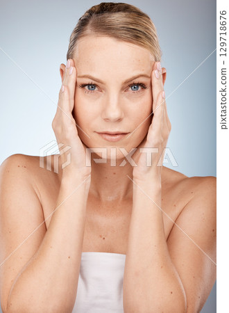 Portrait, woman and skincare in studio for beauty, wellness and eye lift with blepharoplasty on grey background. Face, model and facial for wrinkles prevention with girl hands on skin with mockup Portrait, woman and skincare in studio for beauty, wellness and eye lift with blepharoplasty on grey background. Face, model and facial for wrinkles prevention with girl hands on skin with mockup 129718676