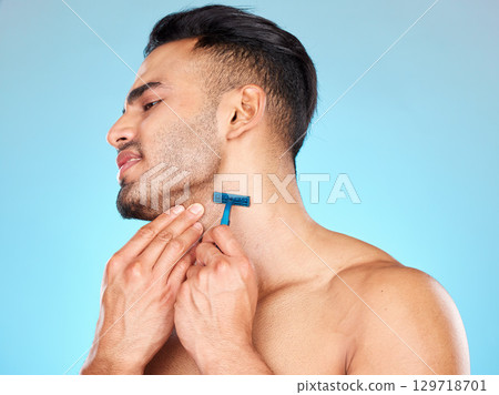 Man, shaving beard and facial skincare cleaning for beauty wellness, morning grooming or self care in studio. Face cleaning, cosmetics dermatology care and shave with razor for self care hygiene 129718701