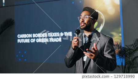 Man, speaker and talk with at conference for carbon border taxes, green trade and future speech. Person, public speaking and solution for eco friendly tariff, global exchange and ecology supply chain 129718990