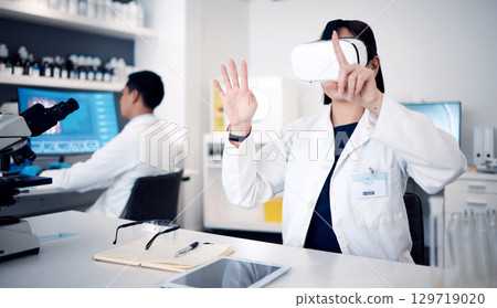 Virtual reality, glasses and science with scientist woman in 3d metaverse, software innovation and biotechnology research in laboratory. VR, ai and futuristic medical expert with cyber technology app Virtual reality, glasses and science with scientist woman in 3d metaverse, software innovation and biotechnology research in laboratory. VR, ai and futuristic medical expert with cyber technology app 129719020