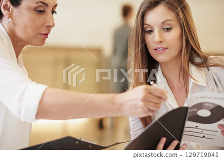 Business women, finance report and working, meeting and paperwork with graphs, charts and collaboration on corporate project. Help, company and female work together on accounting and financial notes. 129719041