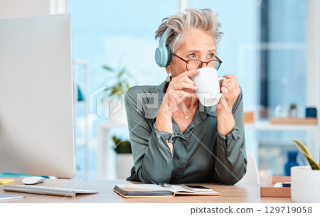 Office woman, headphones and coffee break at her desk for business inspiration, creative planning and brainstorming at a marketing company. Boss thinking of ideas with coffee, and listening to music 129719058