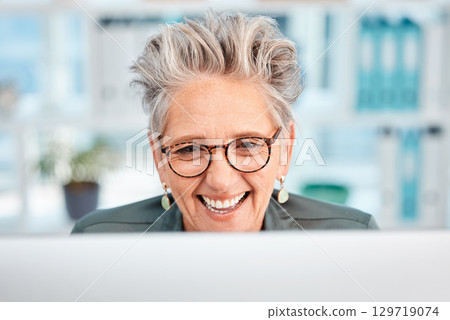 Happy, email and senior business woman networking, planning and reading communication on a computer. Online conversation, web connection and face of an employee smile for corporate website on a pc 129719074