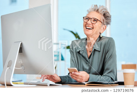 Happy senior, executive woman and computer at office desk, smile and reading on social media, email or meme. Elderly manager, receptionist or communication expert with happiness, comic or funny laugh 129719076
