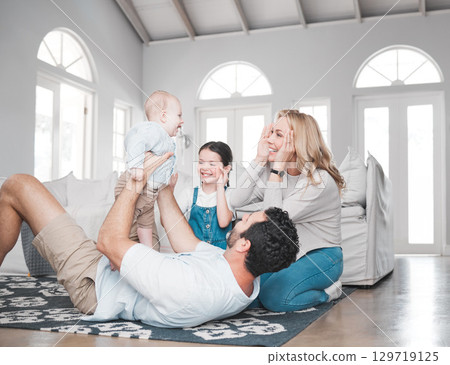 Happy family, baby kids and parents on living room floor, house and lounge for relax, fun game or quality time together. Mother, father and excited children playing in family home, love and happiness 129719125