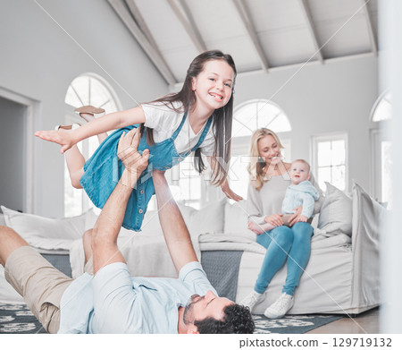 Happy, airplane and family playing in the living room together while bonding in their modern home. Happy, smile and parents relaxing with their children with love, care and happiness in a house. 129719132
