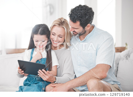 Education, learning and girl with parents and tablet for cartoon, movie or video on the web. Social media, connection and mother and father with an app on technology and child in their family home Education, learning and girl with parents and tablet for cartoon, movie or video on the web. Social media, connection and mother and father with an app on technology and child in their family home 129719140
