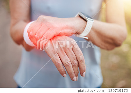 Woman, wrist pain and red injury on sports workout, wellness exercise and health training in forest. Zoom on hands, fitness strain and medical emergency or burnout accident in outdoor nature workout 129719173