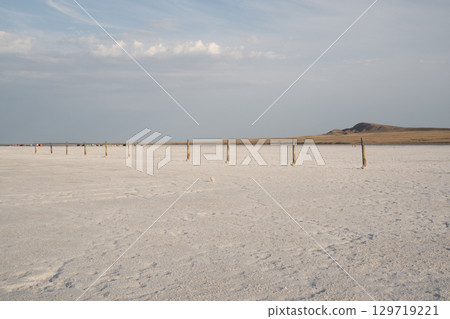 Landscape of the salt lake Baskunchak. View of Mount Big Bogdo. Astrakhan region, Russia Landscape of the salt lake Baskunchak. View of Mount Big Bogdo. Astrakhan region, Russia 129719221