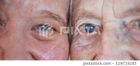 Face, eyes and love with a senior couple closeup inside enjoying retirement while spending time together. Blue eyes, vision and wrinkles with a mature man and woman bonding during a loving moment Face, eyes and love with a senior couple closeup inside enjoying retirement while spending time together. Blue eyes, vision and wrinkles with a mature man and woman bonding during a loving moment 129719285
